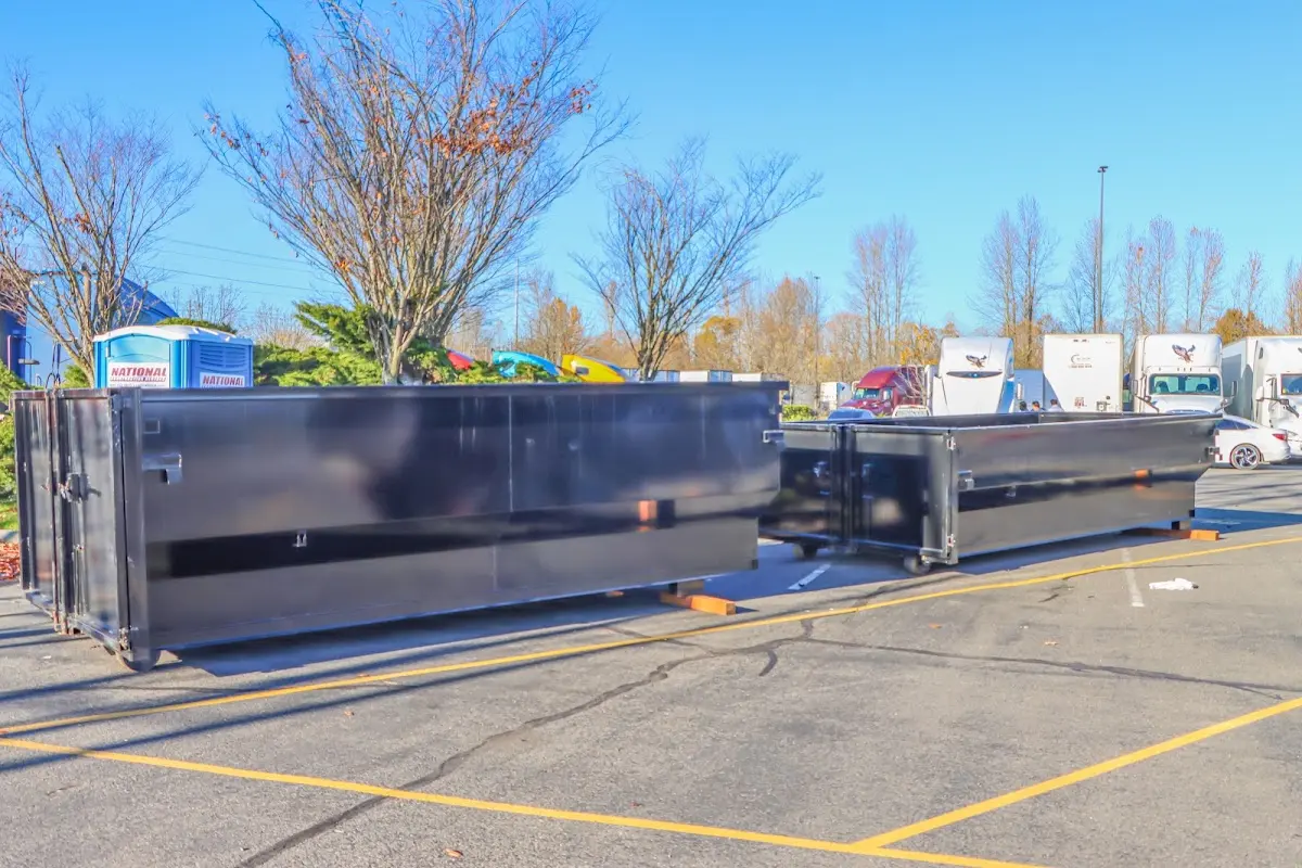 Professional dumpster rental service with roll-off container on residential driveway in Long Grove